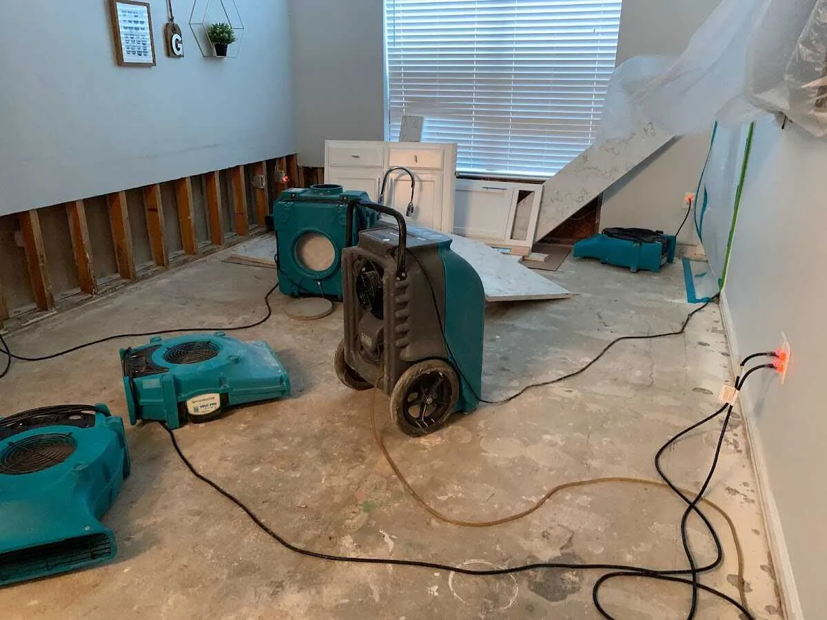 Dehumidifier in flood-cut room for Water Damage Restoration in Stowe